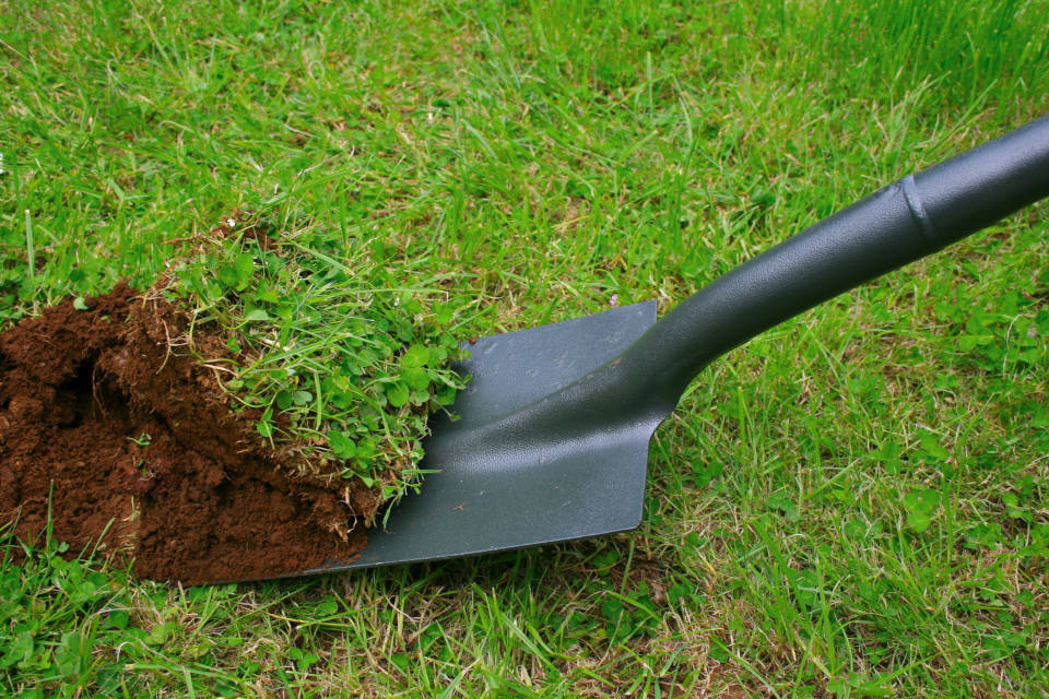 Excavating for a patio using a shovel