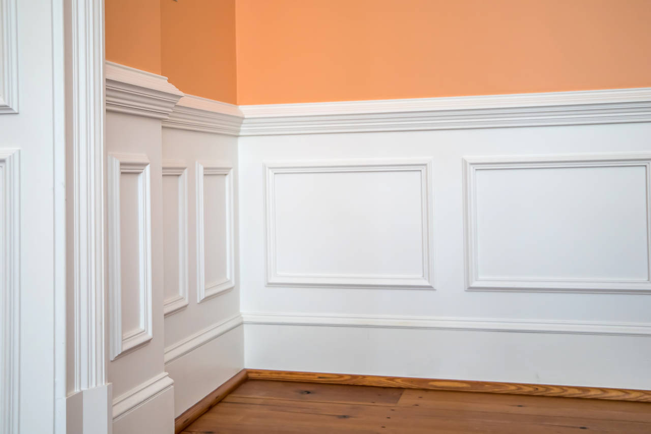 Wainscoting panels laid out evenly on a wall with consistent panel sizes and stile locations